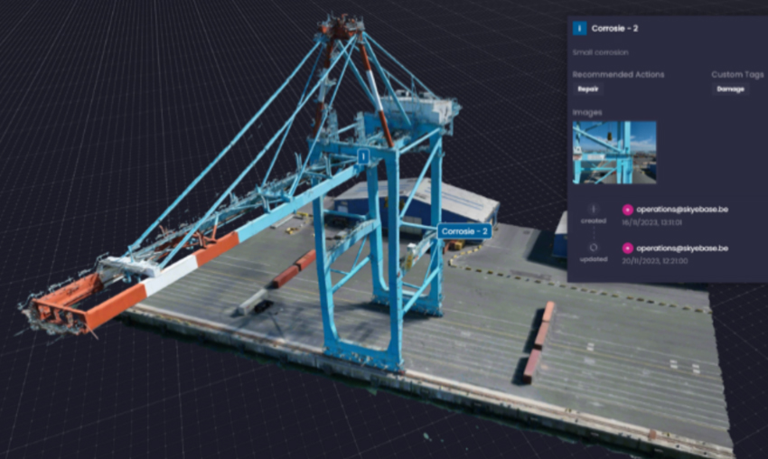 A digital rendering of a large, blue industrial cargo crane on a dock, with a data overlay showing maintenance recommendations and contact information