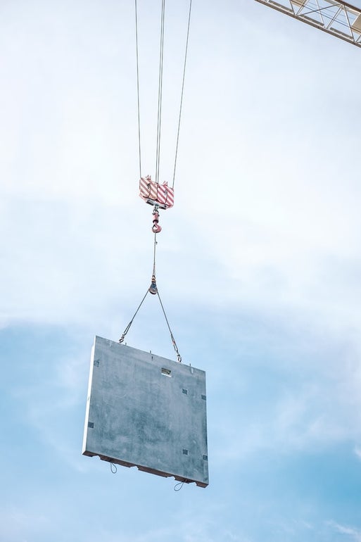 Precast structural concrete product being transported by a construction bim