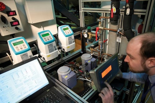 Employee conducting a heat pump test in a controled facility